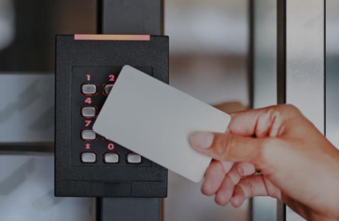 A man entering a building using an access control security system