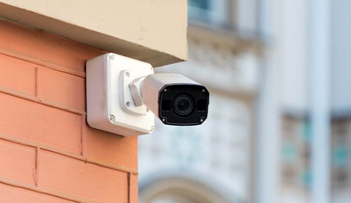 Bullet security camera mounted on a brick wall