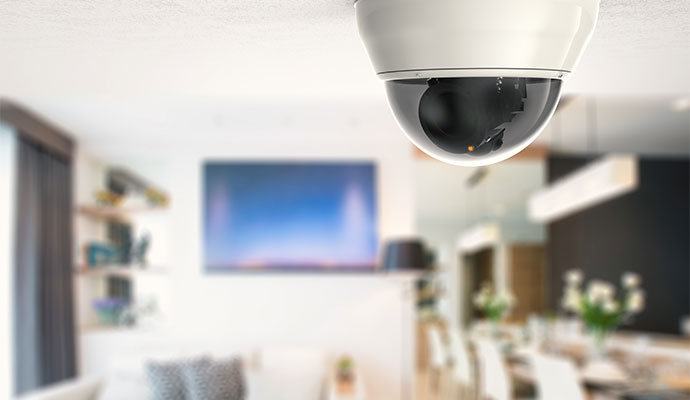 Dome security camera installed on a ceiling