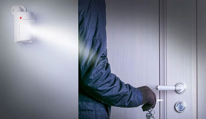 Motion sensor detecting an intruder at a door