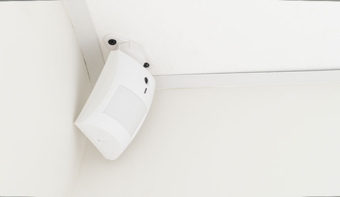 Motion sensor mounted in a room corner