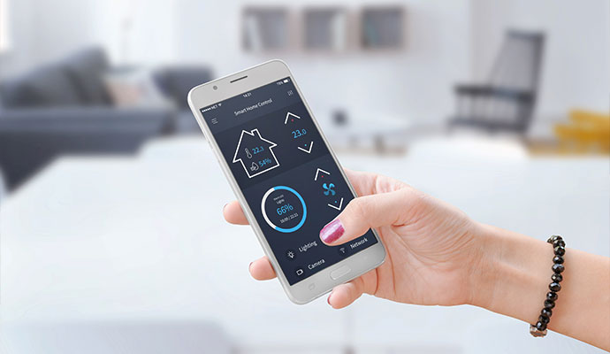 User managing home automation via smartphone