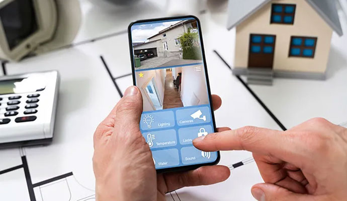 A person using a smartphone to manage security cameras and home automation icons