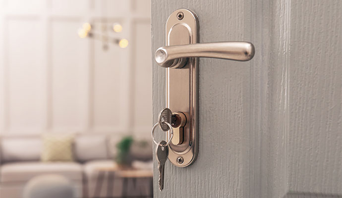 Close-up of a traditional door lock with key