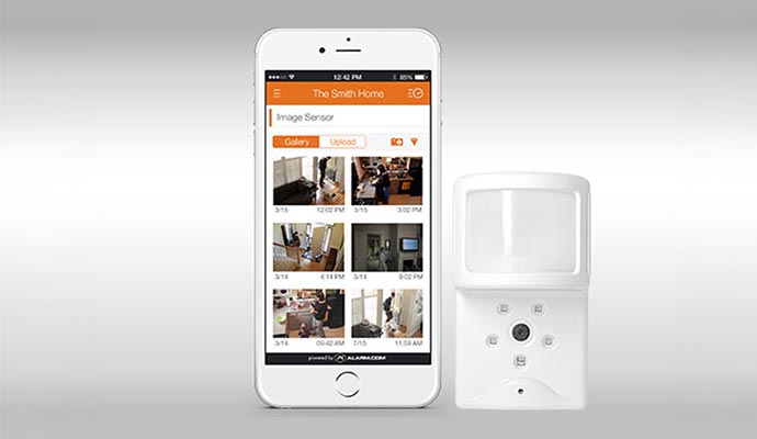 An interface for a burglary detection system alongside a physical sensor device.