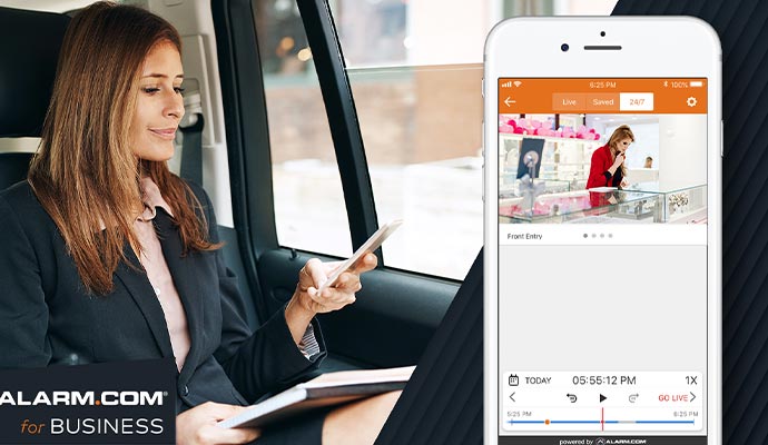 A person monitoring their business remotely from inside a vehicle