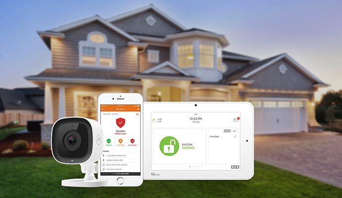 House with a security camera and devices displaying security system interfaces