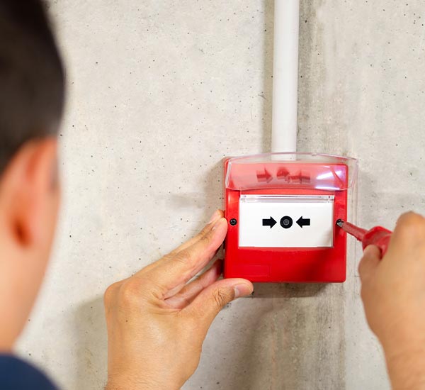 Person is installing a fire alarm audio-evacuation system