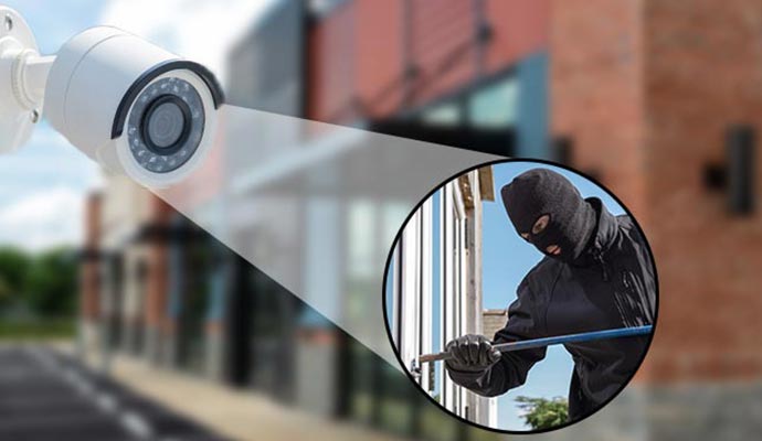 Security camera capturing a burglary in progress.