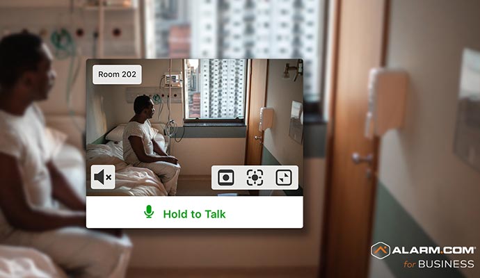 Patient in a hospital room monitored through indoor security camera