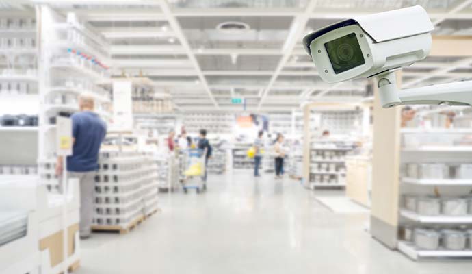 Security camera overlooking checkout and aisles in a retail store