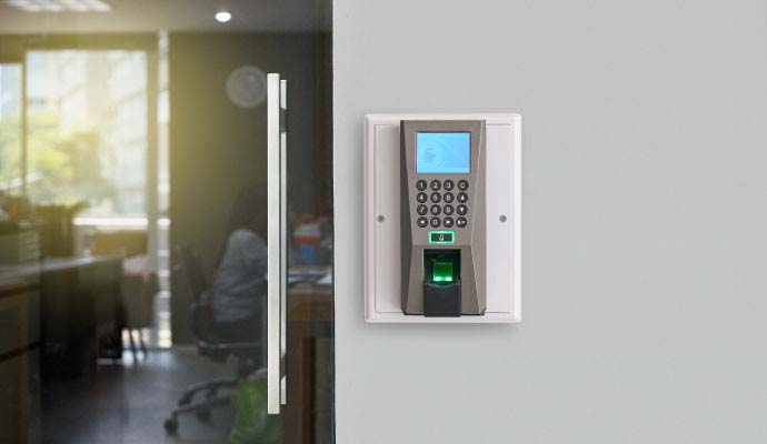 Continental access control system wall terminal next to office entrance door