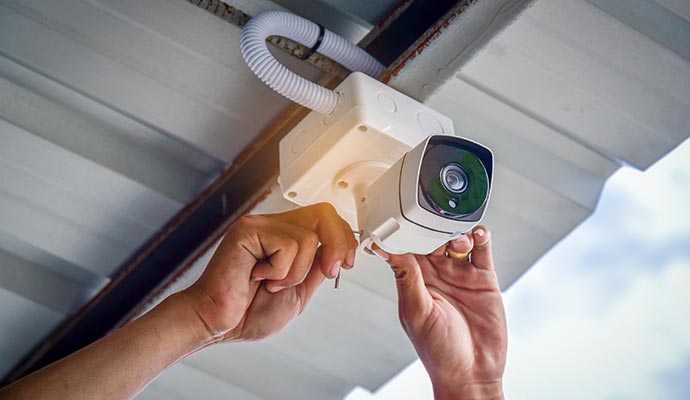 Person installing diy home security camera