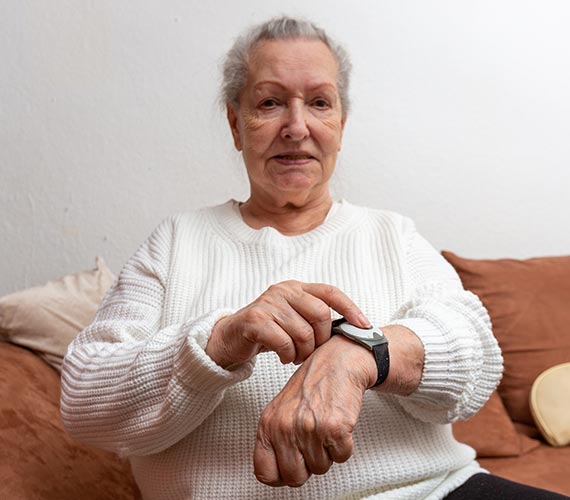 An elderly person using medical alert system