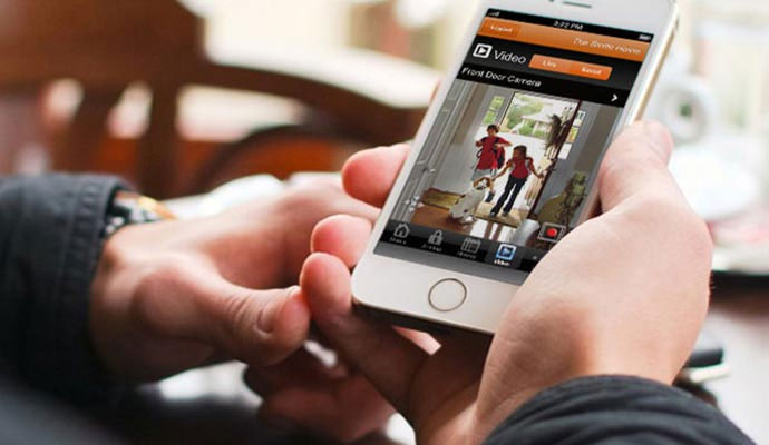 Smartphone displaying live front door security camera video feed