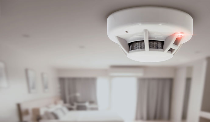 Ceiling-mounted residential smoke detector alarm with indicator light