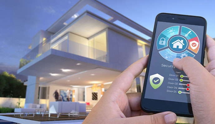 Hands using smart home security and automation app outside modern house