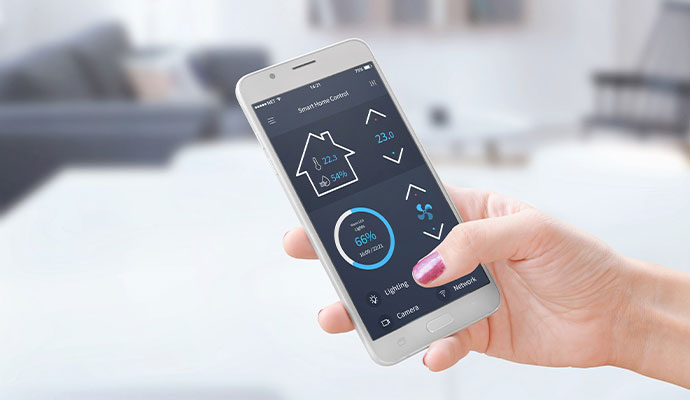 Person holding smartphone with smart home security control app