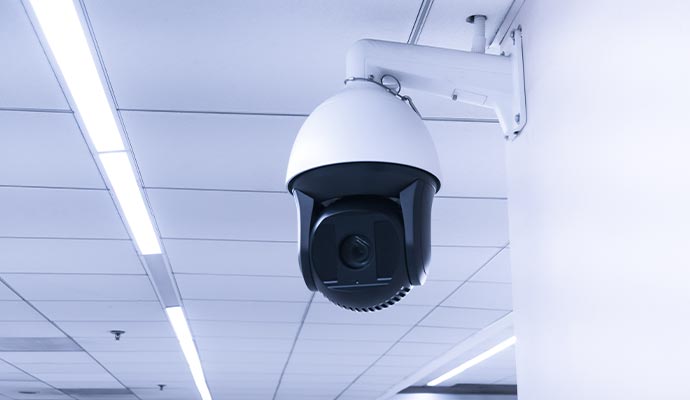 An installed dome security camera mounted on a wall