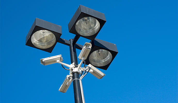 Commercial security lights and cameras mounted on pole