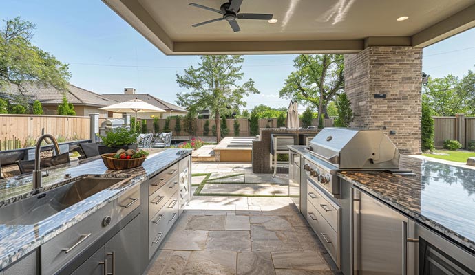 An outdoor kitchen and patio area