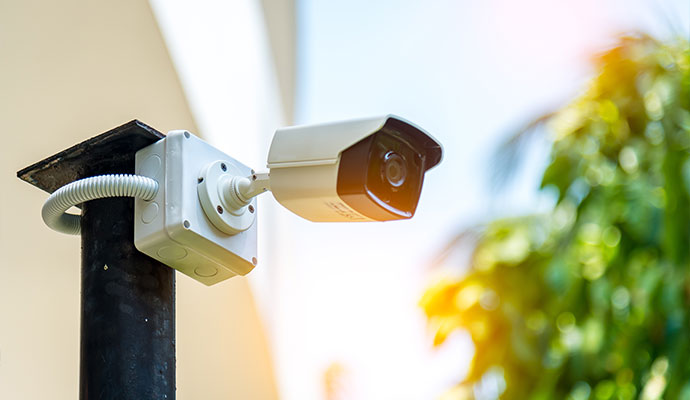 Outdoor security camera installed on a pole