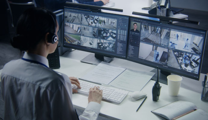 CCTV surveillance operator monitoring screens