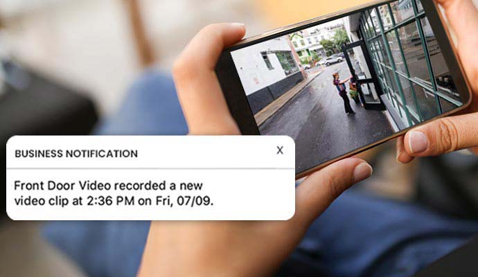 Smartphone displaying real-time commercial business security video clip alert notification