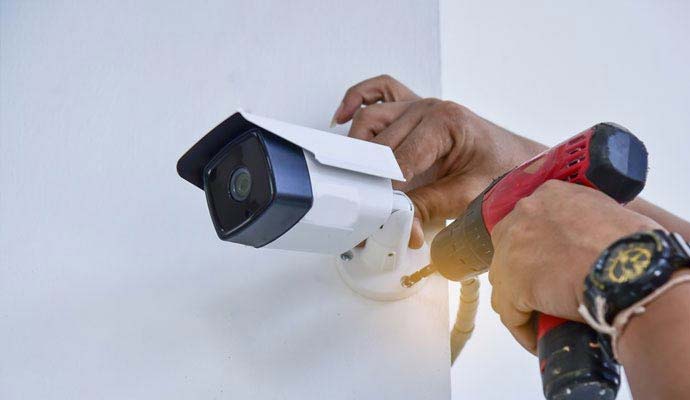 Technician installing HD bullet security camera