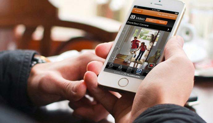 User checking live video feed of kids at front door on smartphone app