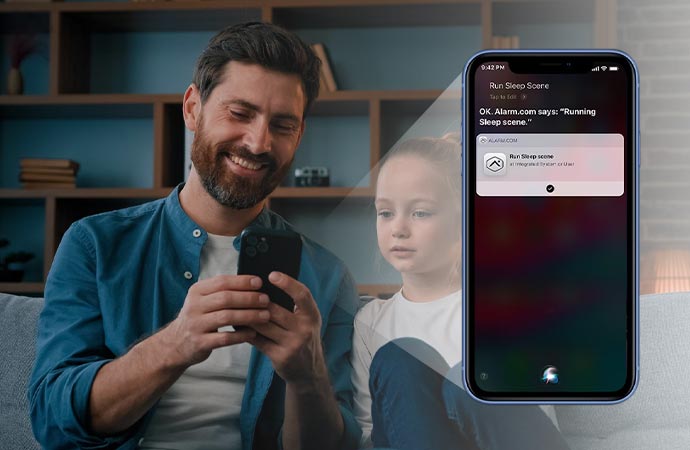 A young man and children engrossed while watching something on a smartphone